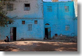 images/Africa/Egypt/AlKab/Village/squatting-man-n-blue-bldg-03.jpg