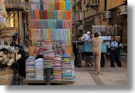 images/Africa/Egypt/Aswan/Misc/man-n-colorful-hats-n-boys-w-cart.jpg