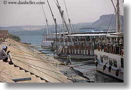 images/Africa/Egypt/Aswan/Misc/men-on-stairs-by-tour-ships-02.jpg