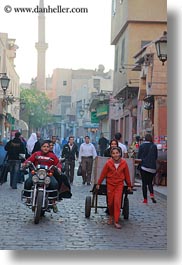 images/Africa/Egypt/Cairo/OldTown/boy-on-motorcycle-n-girl-pulling-cart-01.jpg
