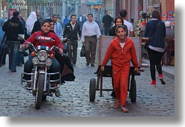 images/Africa/Egypt/Cairo/OldTown/boy-on-motorcycle-n-girl-pulling-cart-02.jpg