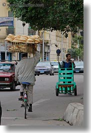 images/Africa/Egypt/Cairo/OldTown/man-on-bicycle-w-bread-on-head.jpg