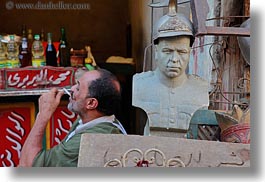 images/Africa/Egypt/Cairo/OldTown/man-smoking-n-military-statue.jpg