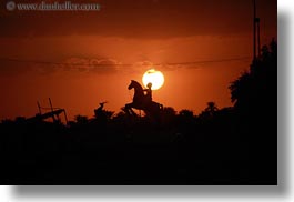 images/Africa/Egypt/Misc/man-on-horse-statue-n-sunset-02.jpg