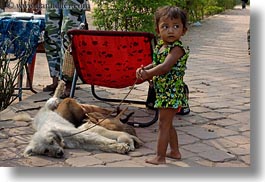 images/Asia/Cambodia/AngkorWat/People/Kids/toddler-n-nursing-dog-w-puppies.jpg
