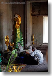 images/Asia/Cambodia/AngkorWat/People/Men/man-w-candle-at-altar-01.jpg