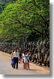 images/Asia/Cambodia/Gates/SouthGate/people-walking-by-statues-1.jpg