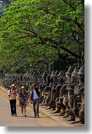 images/Asia/Cambodia/Gates/SouthGate/people-walking-by-statues-2.jpg