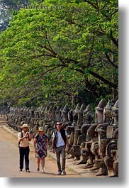 images/Asia/Cambodia/Gates/SouthGate/people-walking-by-statues-3.jpg