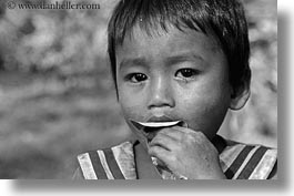 images/Asia/Cambodia/People/Boys/boy-eating-leaf-1-bw.jpg