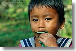 images/Asia/Cambodia/People/Boys/boy-eating-leaf-1.jpg