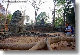 images/Asia/Cambodia/TaPromh/Temples/wide-view-of-ruins-woman-w-camera.jpg