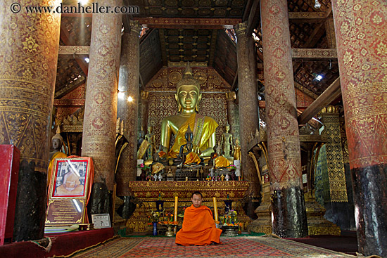 monk-sitting-by-golden-buddha-2.jpg