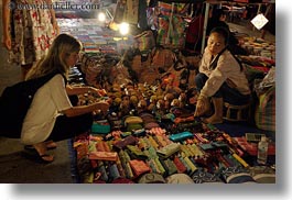 images/Asia/Laos/LuangPrabang/Market/woman-buying-trinkets.jpg