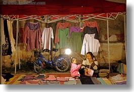 images/Asia/Laos/LuangPrabang/Market/woman-n-daughter-n-bike-w-shirts.jpg