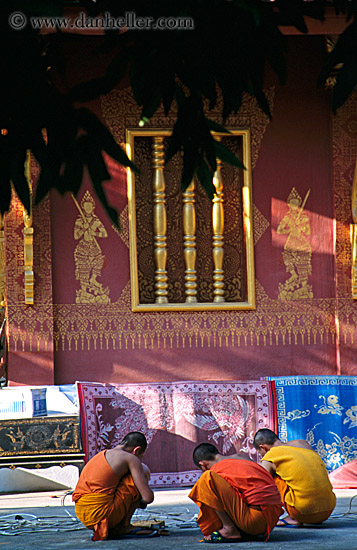 squatting-monks-by-temple.jpg