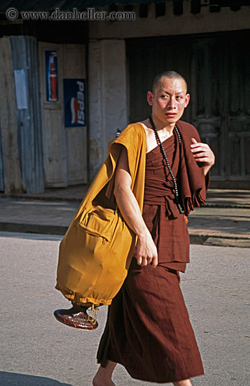 worried-monk-walking-w-alms-container.jpg