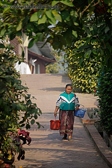 woman-carrying-buckets-w-trees.jpg