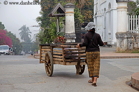 woman-pushing-wood-cart.jpg