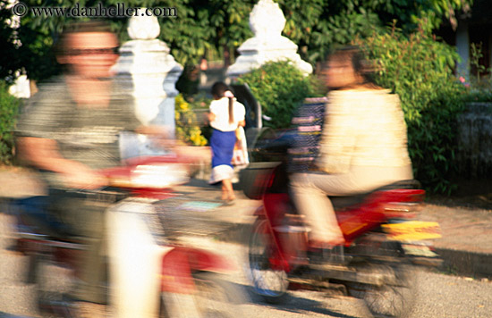 woman-walking-w-speeding-motorcycles.jpg