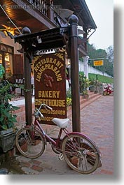 images/Asia/Laos/LuangPrabang/Transportation/Bikes/bike-parked-by-bakery-sign.jpg