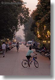 images/Asia/Laos/LuangPrabang/Transportation/Bikes/boy-on-bike-in-street-2.jpg
