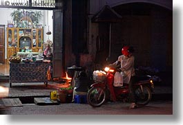 images/Asia/Laos/LuangPrabang/Transportation/Bikes/motorcycle-headlight-n-store-at-nite.jpg