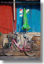 images/Asia/Laos/LuangPrabang/Transportation/Bikes/pink-bike-by-green-umbrella-1.jpg