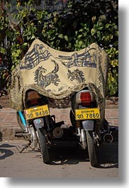 images/Asia/Laos/LuangPrabang/Transportation/Bikes/two-motorcycles-under-horse-rug.jpg