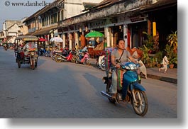 images/Asia/Laos/LuangPrabang/Transportation/Bikes/woman-on-blue-motorcycle-in-town.jpg