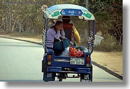images/Asia/Laos/LuangPrabang/Transportation/Cars/tuk_tuk-w-girl-on-cell-phone.jpg