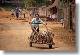 images/Asia/Laos/Villages/Hmong-3/Misc/woman-pushing-cart-of-logs.jpg