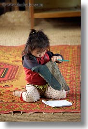 images/Asia/Laos/Villages/Hmong-3/School/girl-w-pencil-n-paper-on-rug-7.jpg