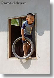 images/Asia/Laos/Villages/RiverVillage1/Boys/boy-in-window-w-tire.jpg