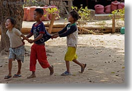 images/Asia/Laos/Villages/RiverVillage1/Groups/children-pulling-shirts-2.jpg