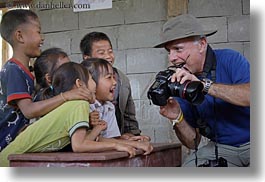 images/Asia/Laos/Villages/RiverVillage1/Groups/man-showing-camera-to-kids-2.jpg