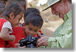 images/Asia/Laos/Villages/RiverVillage1/Groups/man-showing-camera-to-kids-4a.jpg
