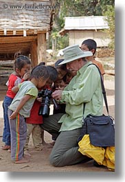 images/Asia/Laos/Villages/RiverVillage1/Groups/man-showing-camera-to-kids-5.jpg