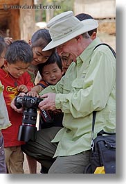 images/Asia/Laos/Villages/RiverVillage1/Groups/man-showing-camera-to-kids-6.jpg