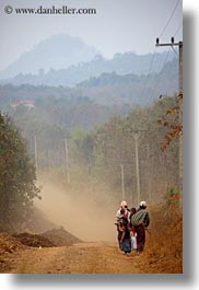 images/Asia/Laos/Villages/Rural/family-walking-on-dirt-road-w-mtns.jpg