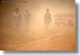 images/Asia/Laos/Villages/Rural/people-walking-in-dust-by-sign.jpg