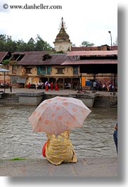 images/Asia/Nepal/Kathmandu/Pashupatinath/Women/woman-w-umbrella-by-river-01.jpg