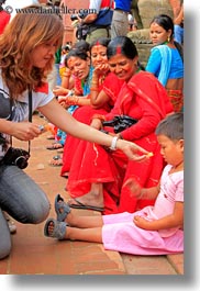 images/Asia/Nepal/Kathmandu/PatanDarburSquare/Women/photographer-woman-feeding-child.jpg