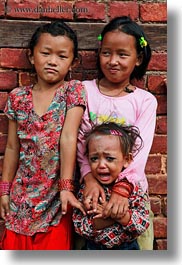 images/Asia/Nepal/Kathmandu/PatanDarburSquare/Women/smiling-girls-n-crying-baby-02.jpg