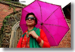 images/Asia/Nepal/Kathmandu/PatanDarburSquare/Women/tour-guide-w-umbrella.jpg