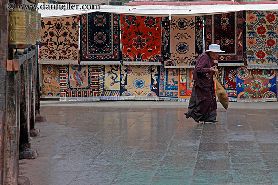 old-woman-walking-by-rugs.jpg