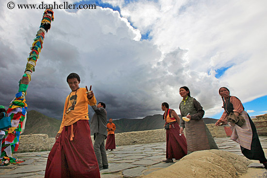 people-walking-by-prayer-flag-pole-02.jpg