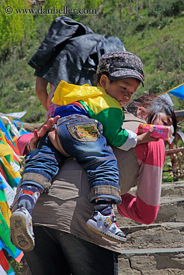 toddler-boy-on-mothers-back.jpg