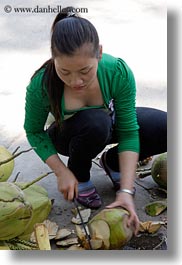 images/Asia/Vietnam/HaLongBay/People/woman-cutting-coconuts.jpg
