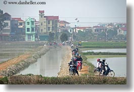 images/Asia/Vietnam/Hanoi/Bikes/Crowds/motorcycles-driving-by-water.jpg